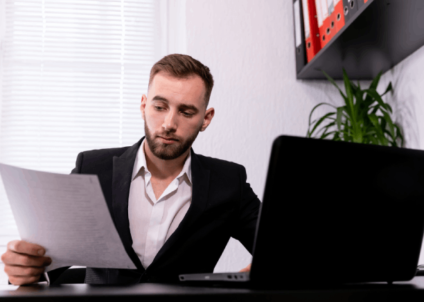A professional translator working on business doc translations in Bethel Park, including contracts and financial statements.
