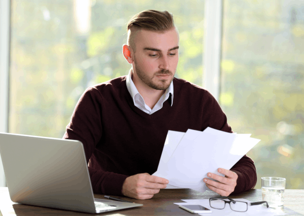 A client utilizing certified translation documents in Bethel Park, ensuring they meet legal and government requirements.