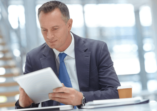 Translator checks USCIS forms and certificates at a desk, providing Translation Services in McCandles with USCIS certified.