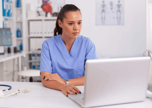 A doctor uses translation to review a patient's medical record in Penn Hills, ensuring clarity and compliance with standards.