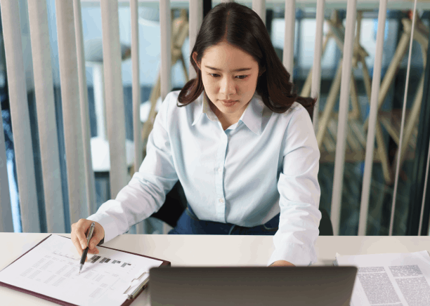 A translator compares a Vietnamese legal brief to the English version, providing Vietnamese Translation Services.