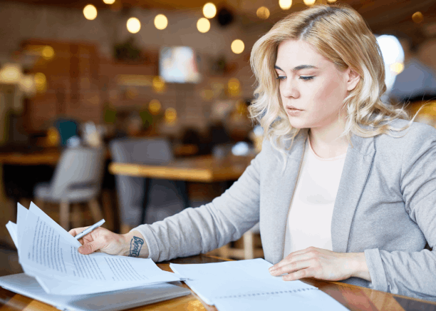 A client reviews an accuracy-checked Russian letter with a translator, showcasing Russian Translation Services in Pittsburgh.