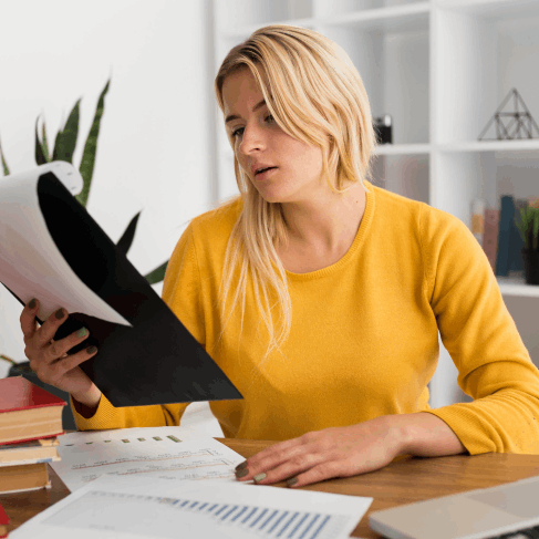 A linguist checks a Russian academic transcript for admissions, using Russian Translation Services in Pittsburgh.